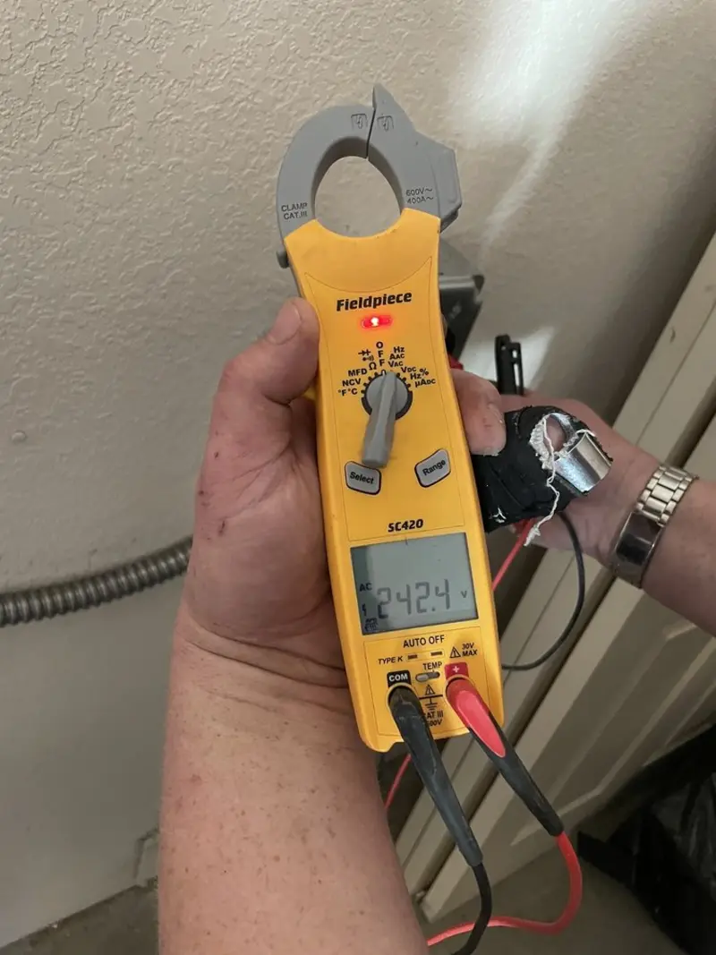 Voltage testing with clamp meter during Generator Installation in Vinton